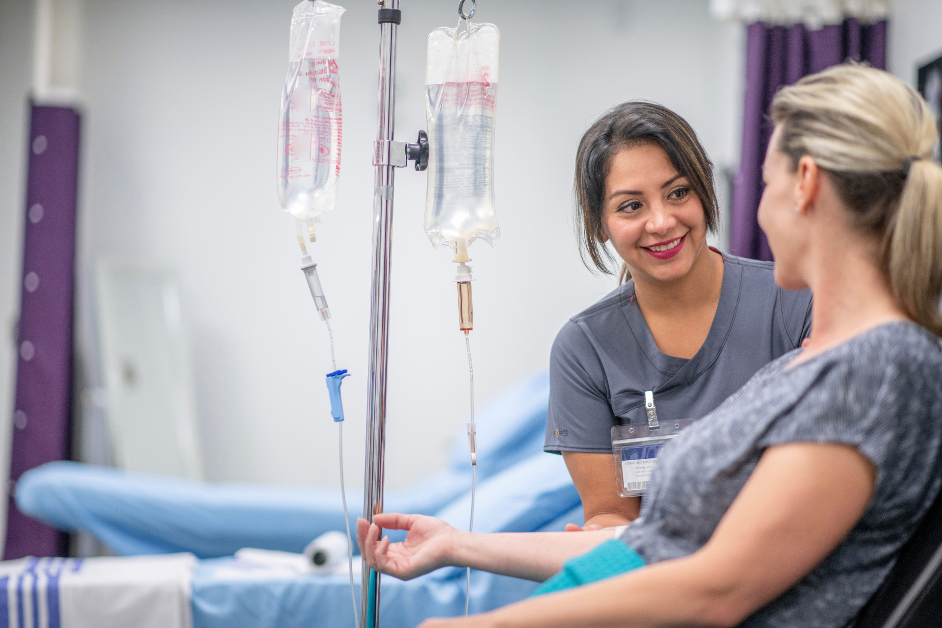 Registered Nurse with a guest during a stem cell IV infusion at iCRYO Guilderland
